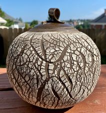 lidded pottery jar with a crackle pattern