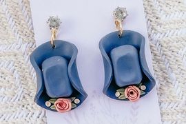 hat shaped earrings adorned with flowers