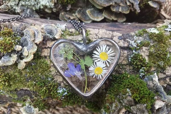 heart shaped pendant with flowers