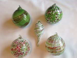 hand blown holiday ornaments decorated in red and green