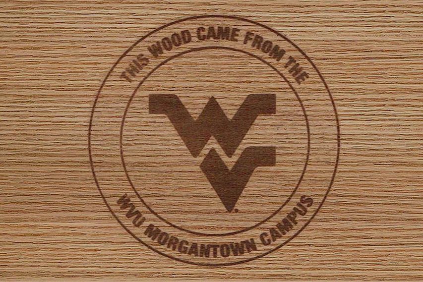 Wood brand that says "This wood came from the WVU Morgantown Campus"