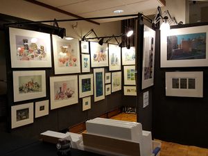 booth displaying many fine art prints