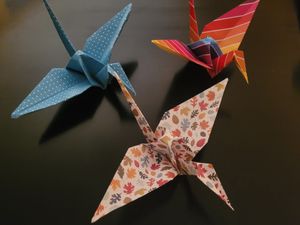 origami peace cranes in various designs