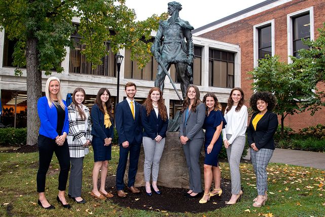 The 2021 Mountaineers of Distinction finalist pose in front the Mountaineer statue outside the Mountainlair.