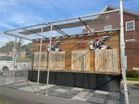 Four wooden targets enclosed in fencing. 