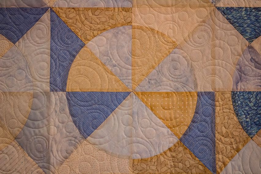Blue, gold and white quilt